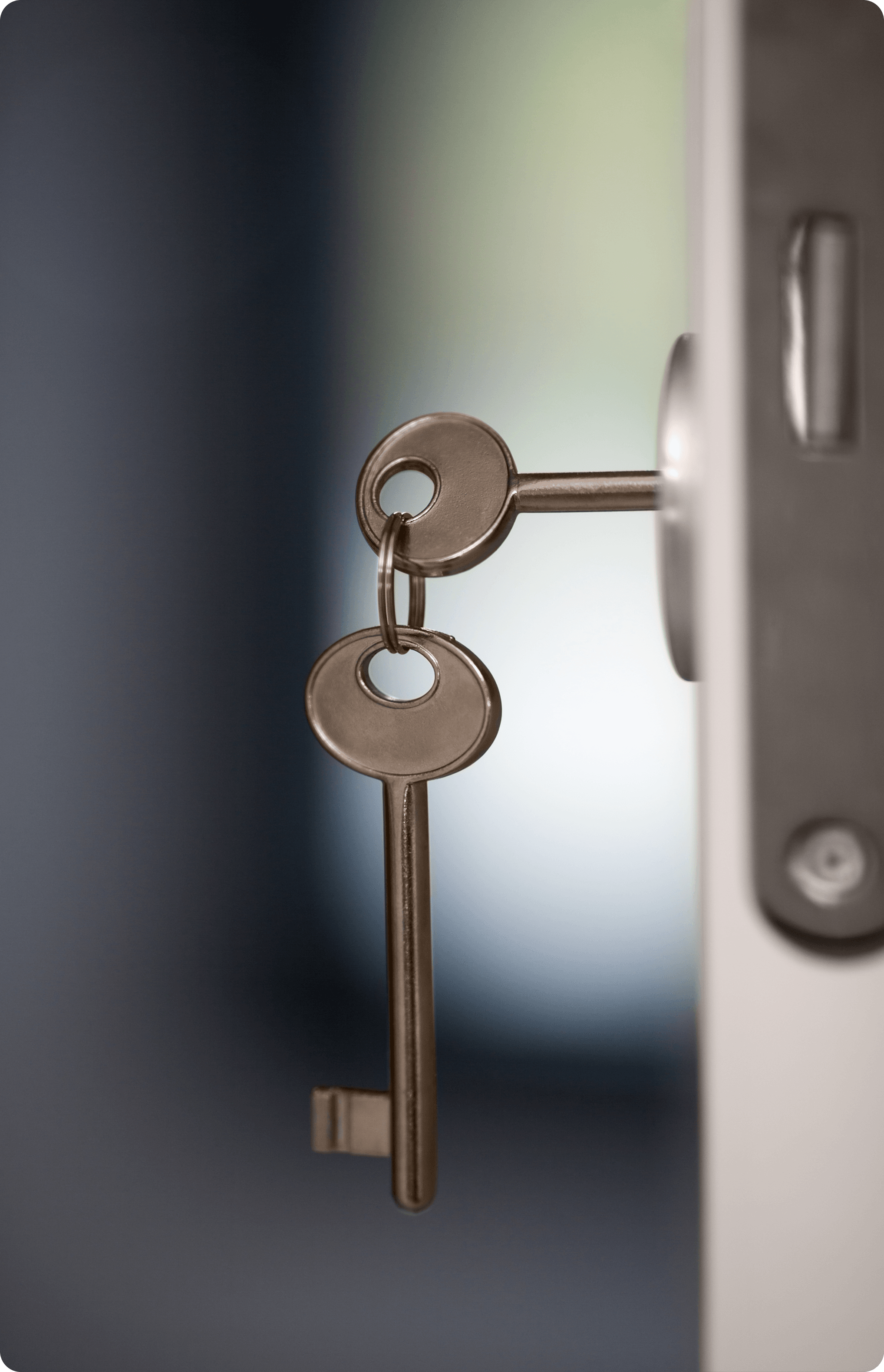 A key hangs from a door handle, indicating it is ready to be used for unlocking the door.